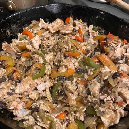 Sautée bell pepper and onion in oil with salt until soft. Add in a few cloves of finely minced garlic and cook for one minute more. Dump in some black beans and the chopped turkey and mix together thoroughly. Season with salt and pepper to taste. Remove from the heat.