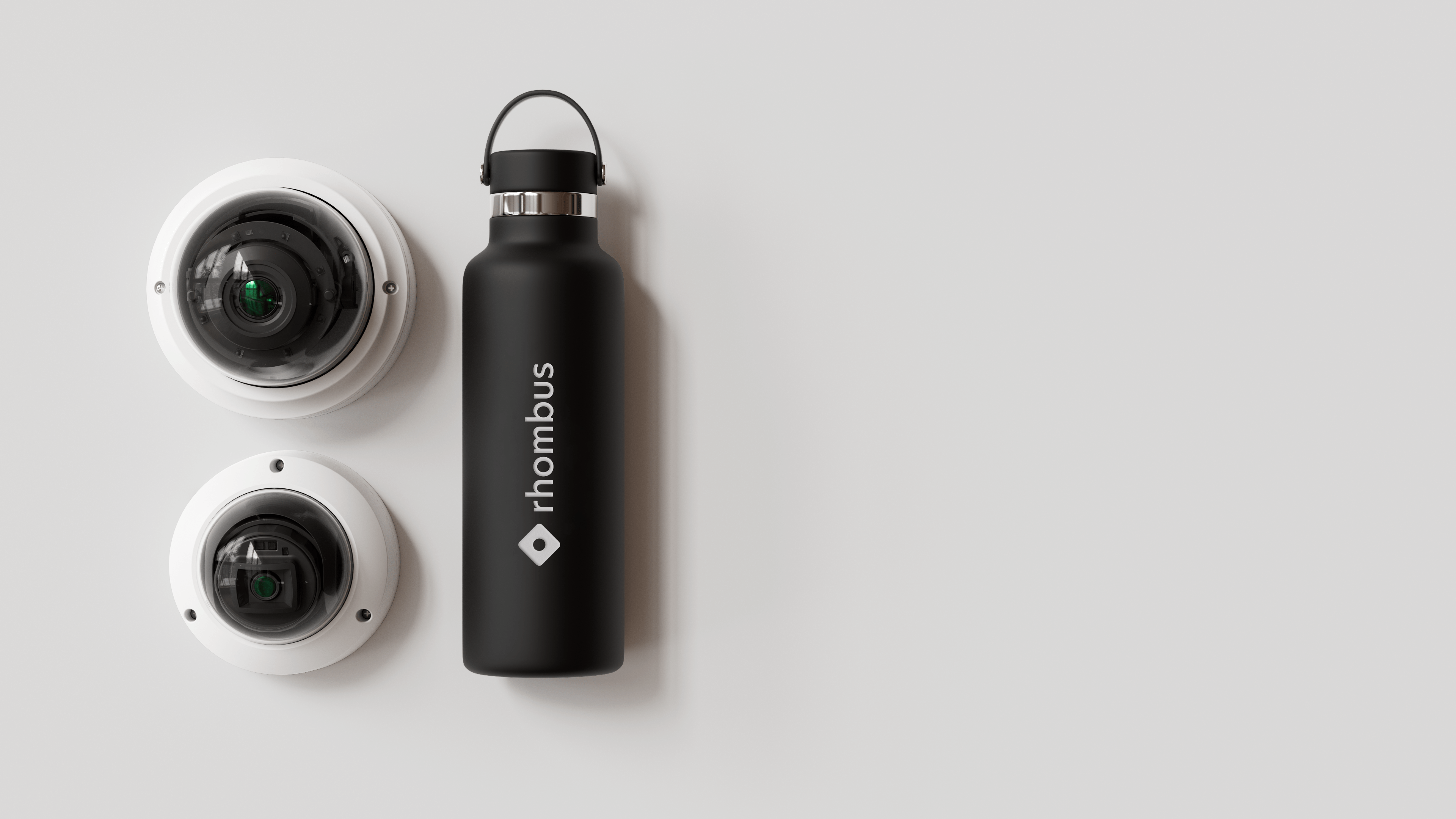 Rhombus cameras next to a Hydroflask