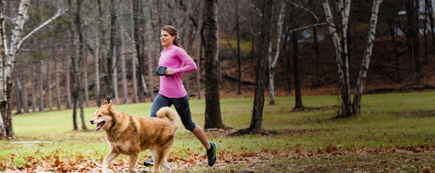 woman jogging with her dog