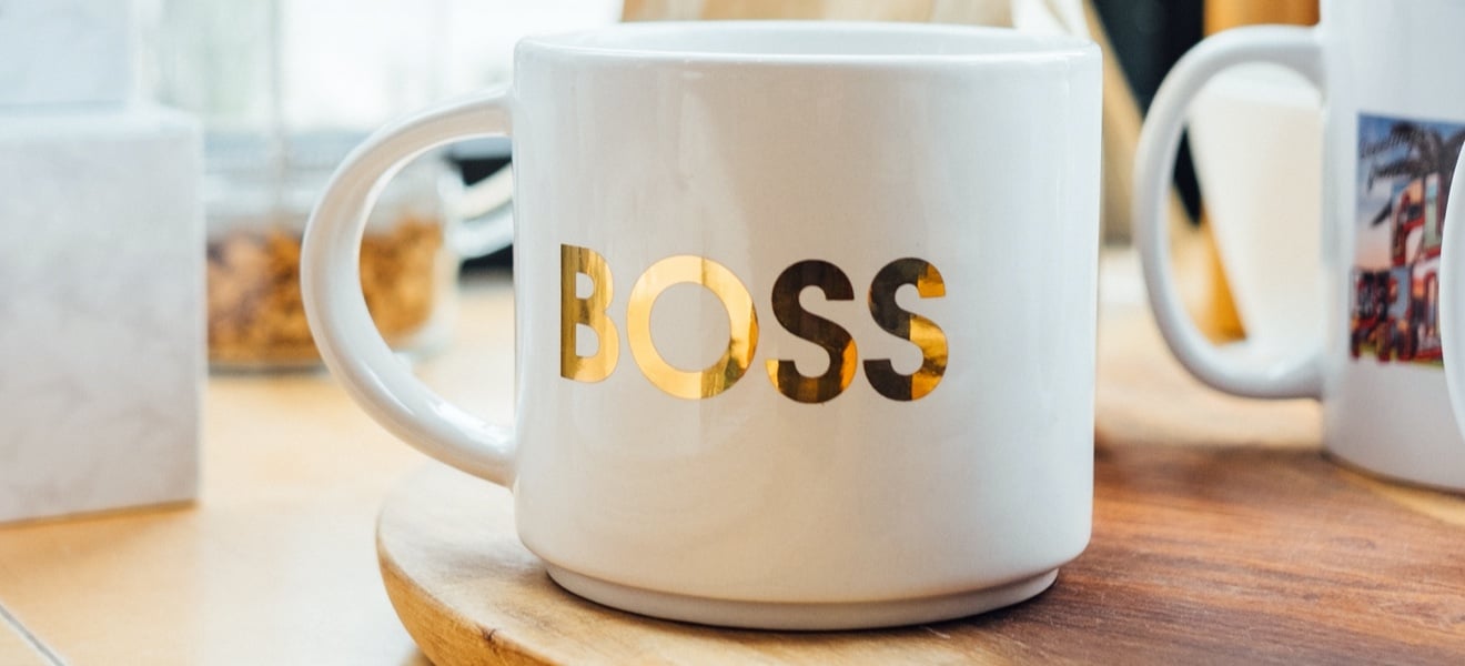 Coffee mug with the word 'Boss' on it.