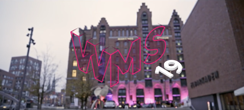 Image titled with graphic letters and numbers "WMS 19" featuring a background of the Hafencity area.