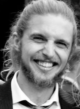 Photo of Jake, smiling on his sister's wedding day