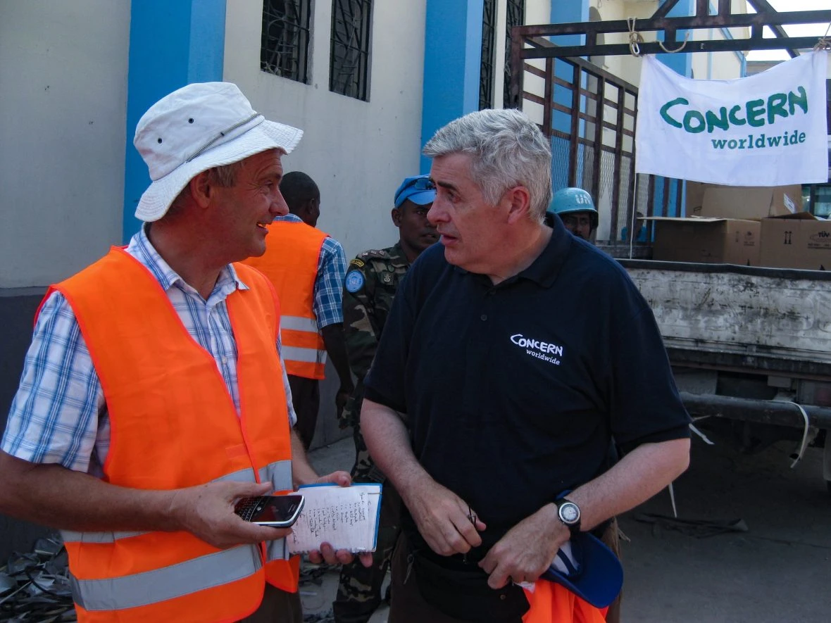 Engineer Tom Dobbin & Concern’s Dominic MacSorley converse in Martissant, Port au Prince, February, 2010.