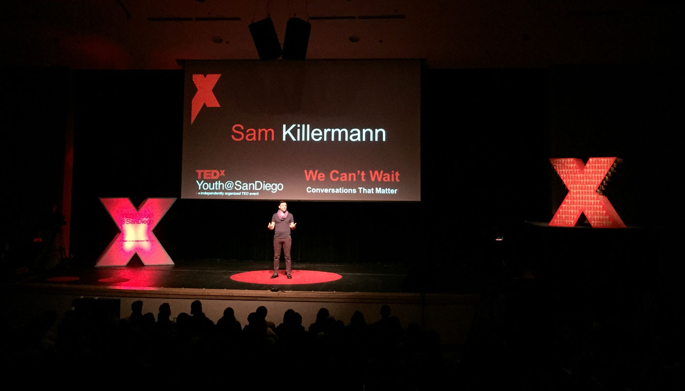 Sam Killermann giving a talk at TEDxYOUTH San Diego in 2015
