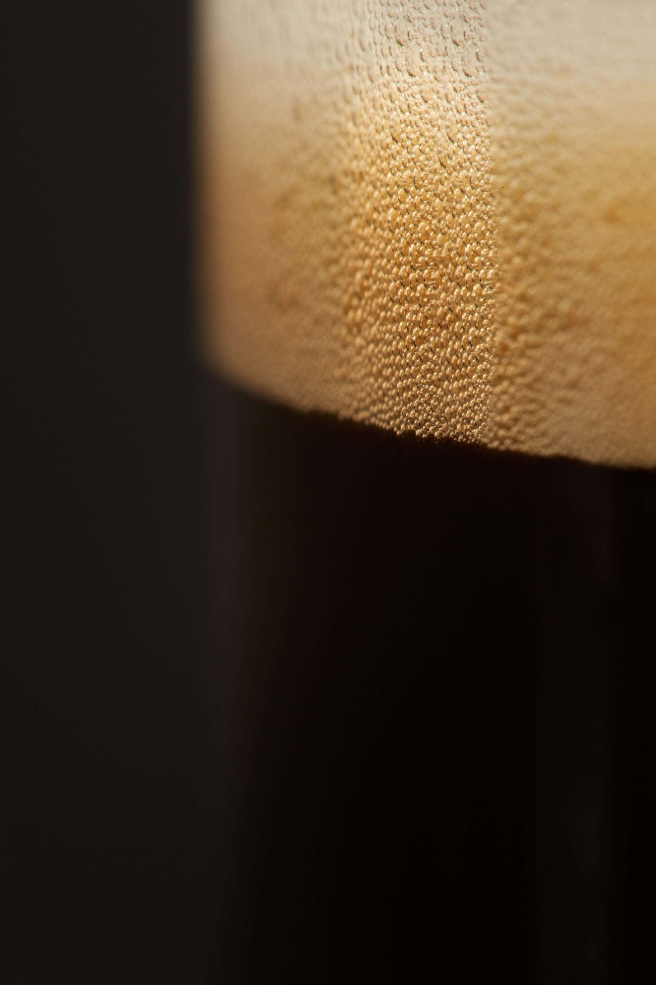 black-coffee-macro in glass of bubbles