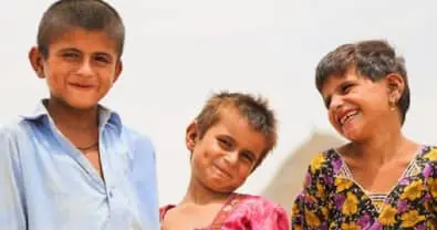Three young smiling children
