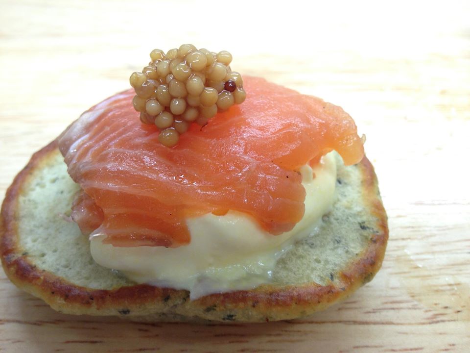 A photo of cured salmon on a cracker
