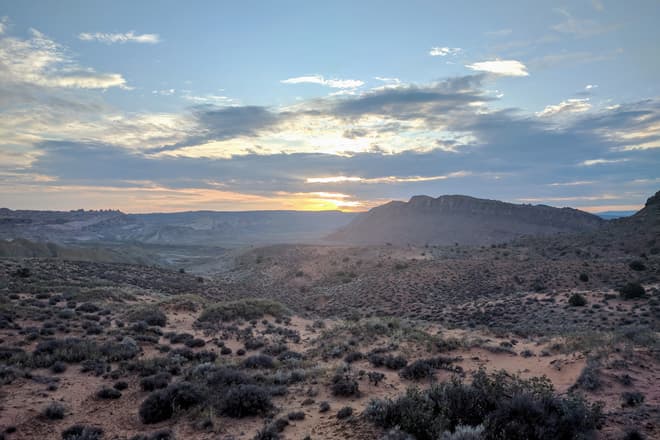A desert sunrise over Arches National Park.