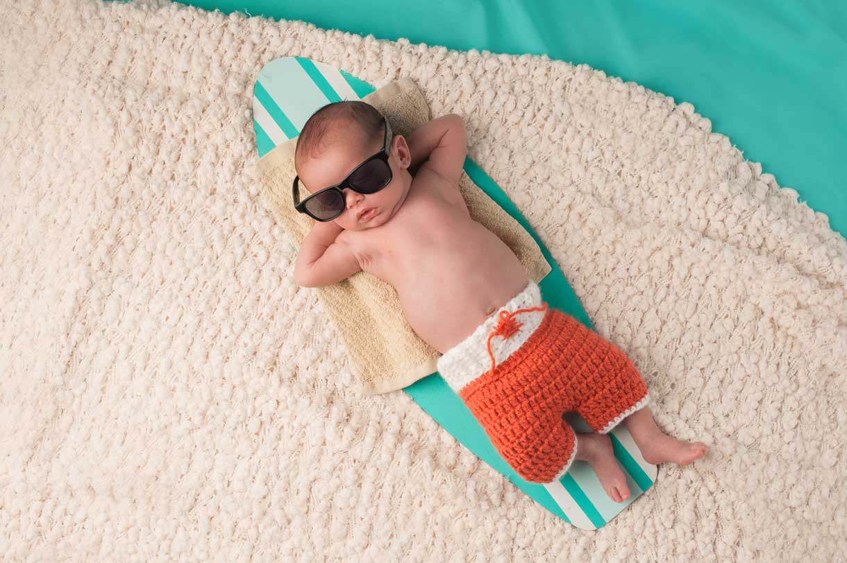 Baby relaxing on a surf board