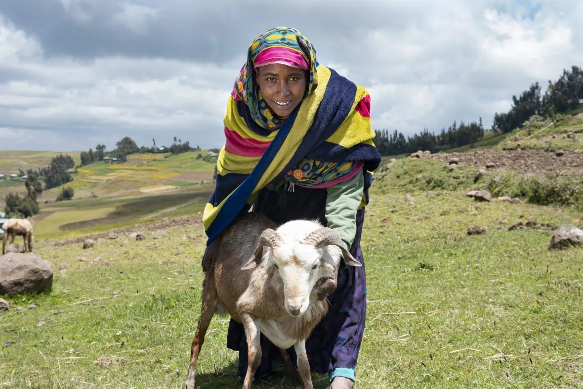 Ethiopian woman with a sheep.