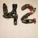 About a dozen shoes and boots from a family of foot sizes, juxtaposed to draw the digits of forty two.