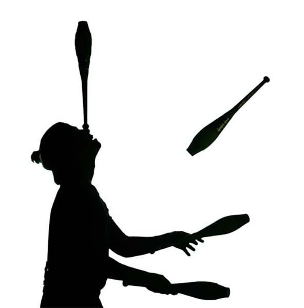 Silhouette of woman juggling