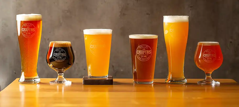 Glasses of different types and colors of beer