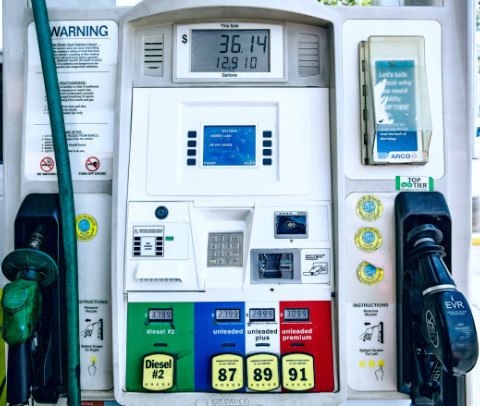 A gas station pump console with clear labels for gas type and cost shown.
