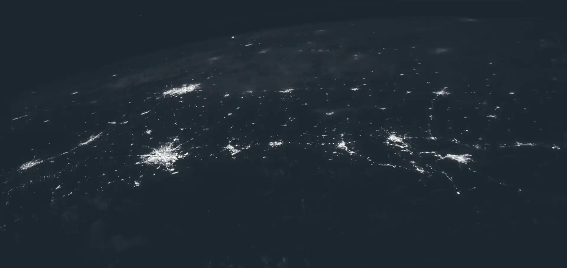 orbital photo overlooking Earth at night taken from the International Space Station