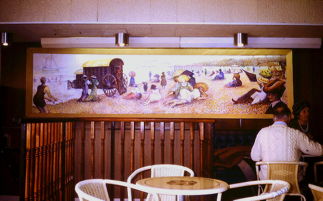 painting of panoramic Victorian seaside resort scene in Pointillist style on a cafe wall