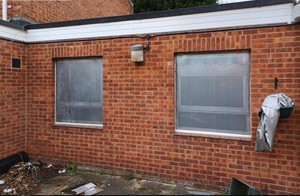 2 windows secured with steel perforated sheets