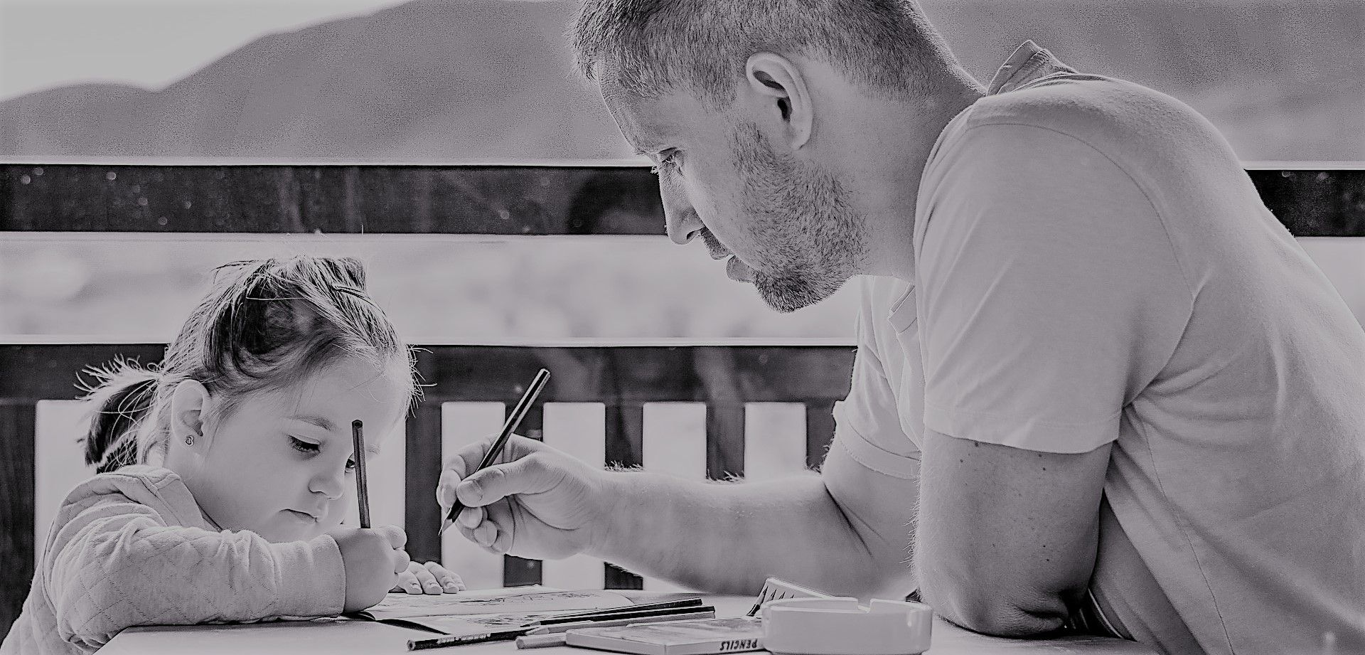 Father and daughter drawing together