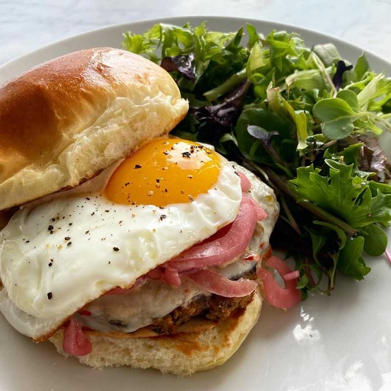 Black bean burgers with chipotle mayo, pepper jack, pickled red onion, and a fried egg. Used the Sally’s Baking Addiction recipe minus feta which was A…