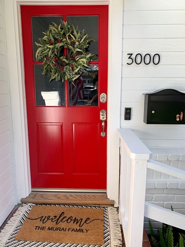 enlarged photo of red painted door with white painted trim