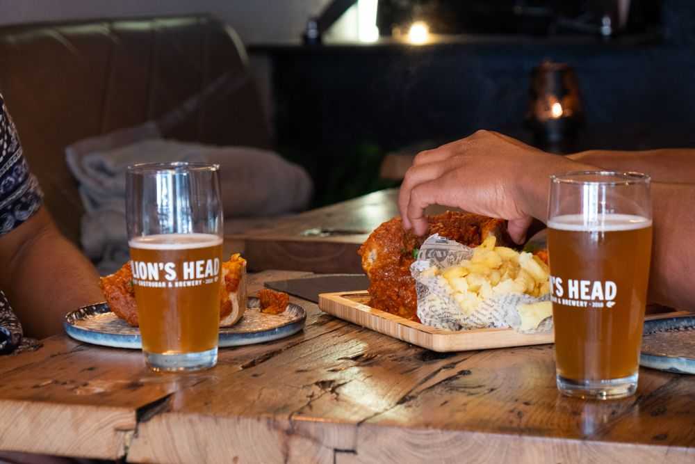 South African dishes and house brewed beer at Amsterdam restaurant Lion's Head. Photo by Webster Mugavazi for Table Sage