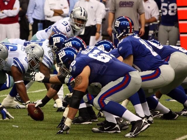 Eli Manning of the NY Giants about to snap the football against the Dallas Cowboys