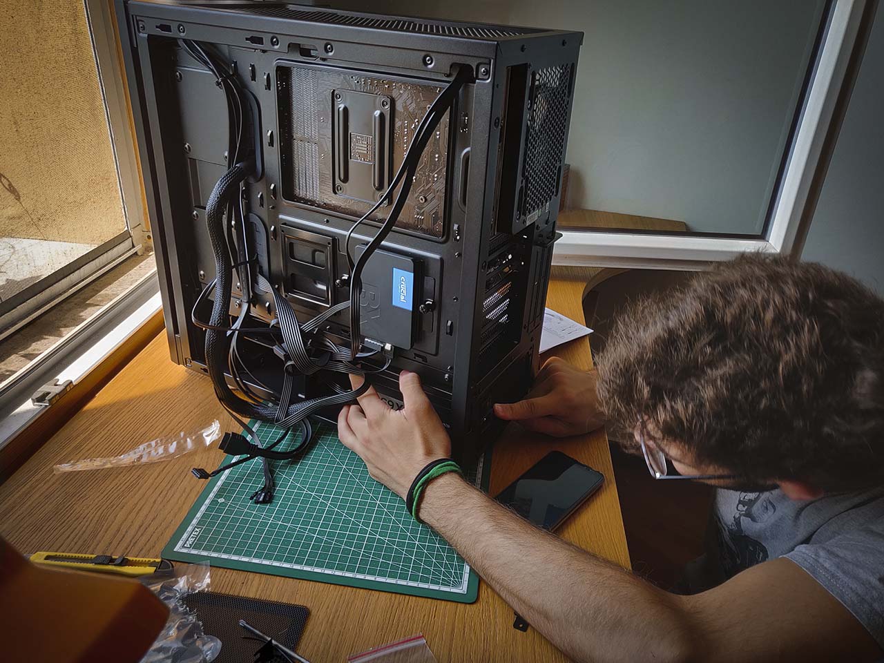 Giorgio inserting a component of the PC into the case Giorgio inserting a component of the PC into the case