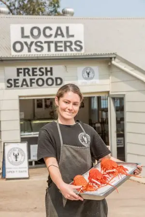 Kristy Holding Lobsters at Narooma Bridge Seafood