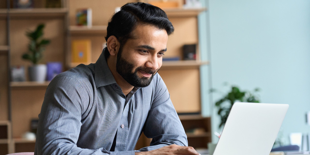 What are the best data cleaning tools? A data analyst sitting at a desk, looking at a laptop