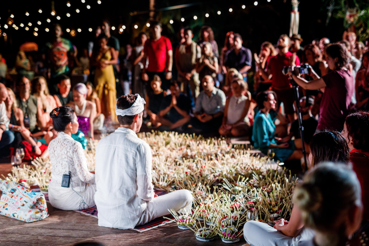 Tya priestess in Bali doing ritual, ceremony, and blessing for 300 people at awesomefest in Nusa Dua