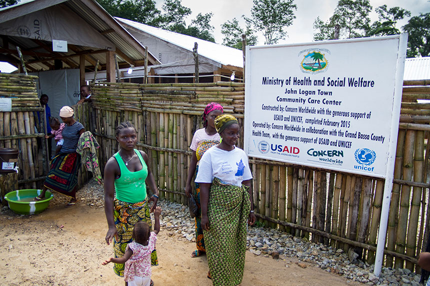 Women leaving a Community Care Center in Liberia