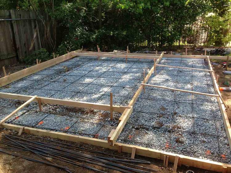 Initial wood form grid with two tier height, steel rebar mesh grid and small wood to create grooves in the patio area. Initial wood form grid with two tier height, steel rebar mesh grid and small wood to create grooves in the patio area.