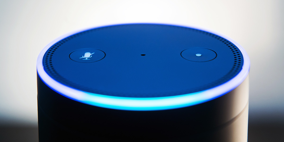 An Amazon Echo smart speaker An Amazon Echo smart speaker device, lit up in the process of receiving a voice command
