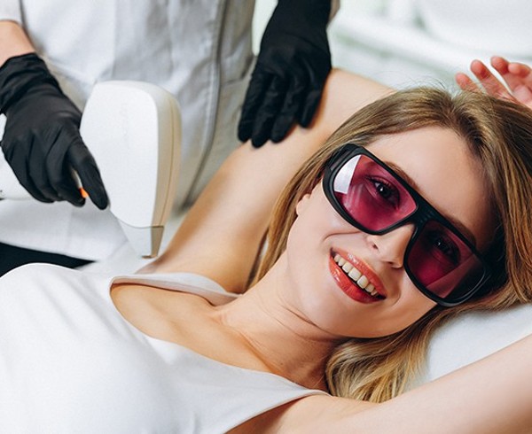 Girl smile during laser hair removal