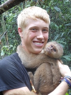 The author hugging a monkey