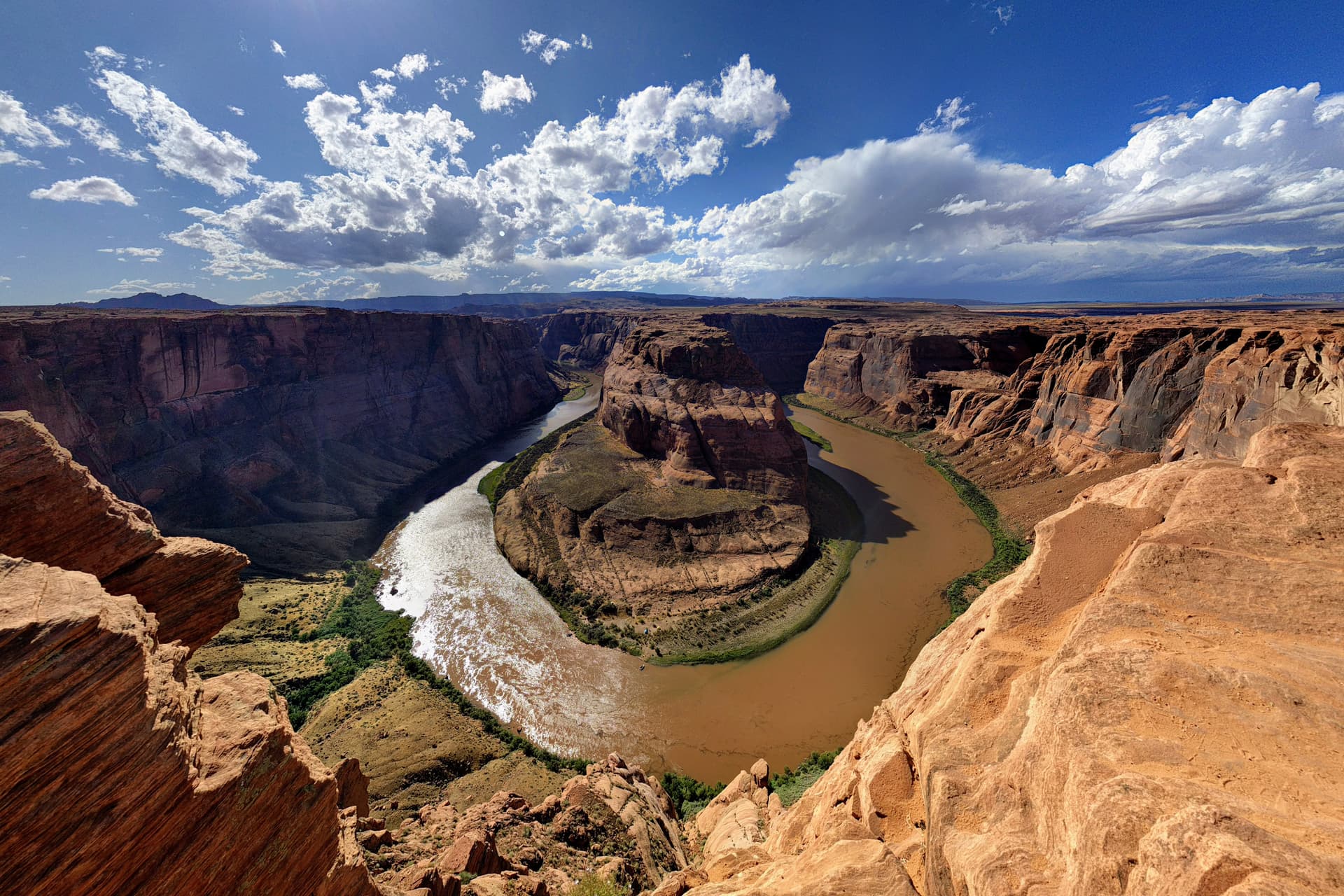 A wide-angle shot of the iconic Horseshoe Bend in the Colorado River (technically within the Grand Canyon National Park, as the park extends from the rim wall to the River all the way to the Glen Canyon Dam).